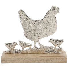 This Aluminum Chicken on Wooden Base is the perfect addition to any home