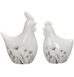 2 assorted designs of a Chicken / Rooster ornament. Each in a simple white colour with a floral pattern.