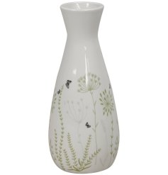 A dainty vase detailed with grey and green flower decals, finished with a simple glaze.
