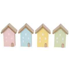 4 assorted coloured wooden house decorations with mini window motifs.