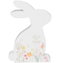 A white freestanding bunny, featuring illustrations of butterflies and spring flowers. 