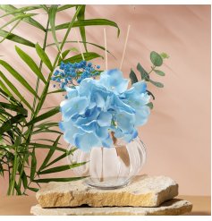This diffuser adds a stylish touch to any room with its blue hydrangea design and continuous fragrance