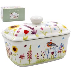 A ceramic butter dish beautifully decorated with watercolour garden birds.