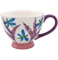A lovely floral mug with dragonfly illustrations and a chunky purple handle.