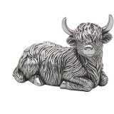 A sweet lying highland cow ornament with rugged fur in a rustic silver tone.