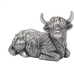 A sweet lying highland cow ornament with rugged fur in a rustic silver tone.