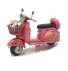 This vintage scooter ornament adds a unique and eye-catching flair to any home