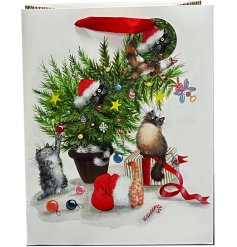 A Christmas tree design gift bag from the Kim Haskins range complete with red ribbon handles.