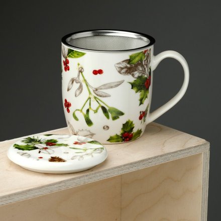 With a tea infusing sieve a beautiful winter botanicals mug with lid.