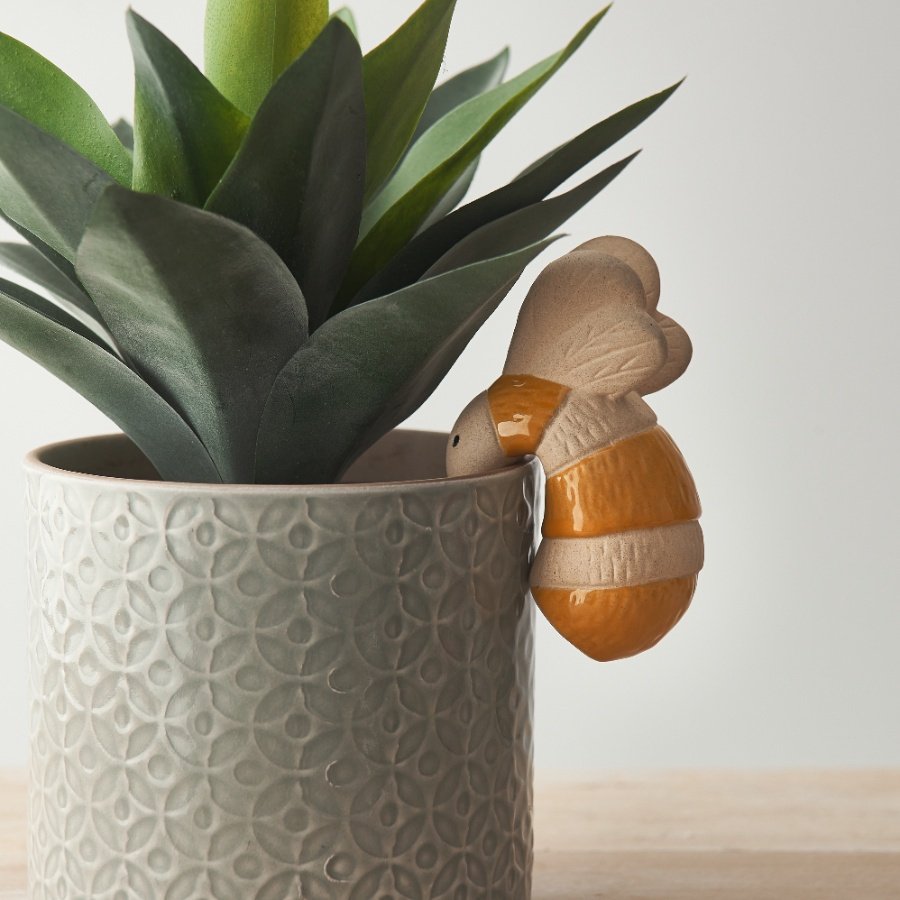 A flower pot hanger in a charming bumble bee design. 