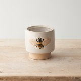 A beautifully crafted stoneware planter with an embossed bee design.
