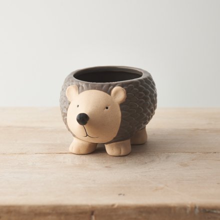 A charming and unique stoneware planter in the shape of an adorable hedgehog. 