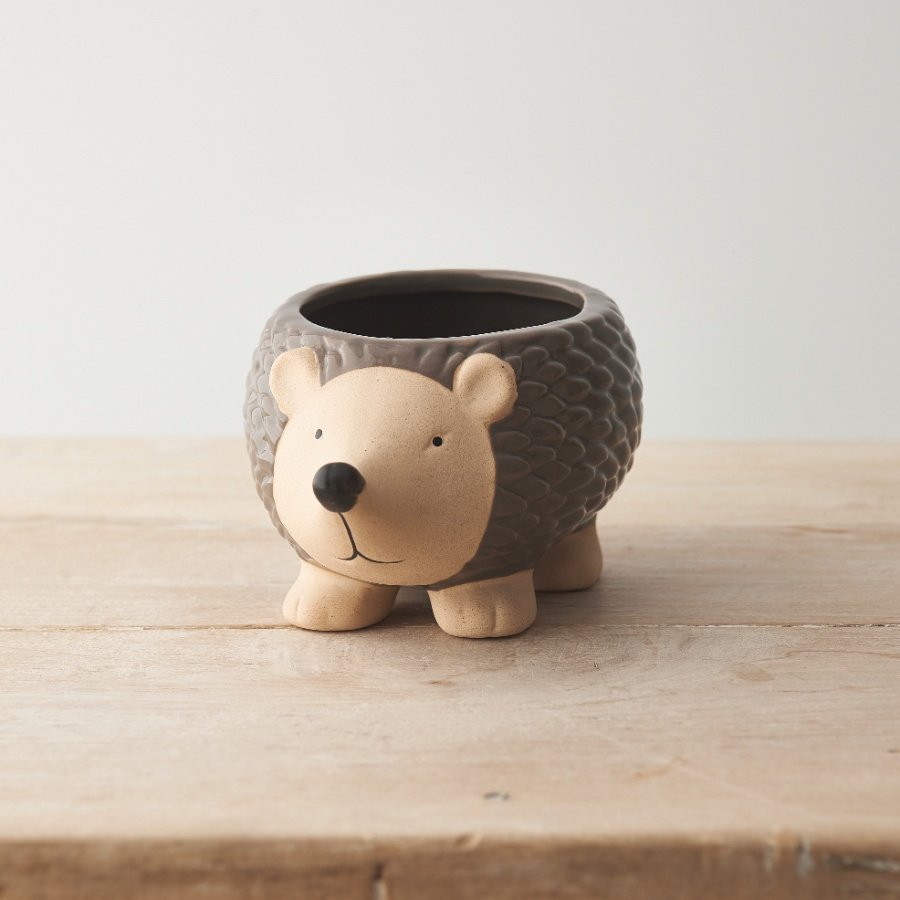 An adorable and unique hedgehog planter with a richly glazed and detailed body. 