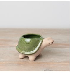 A unique tortoise planter with a natural stoneware planter and richly glazed green shell. 
