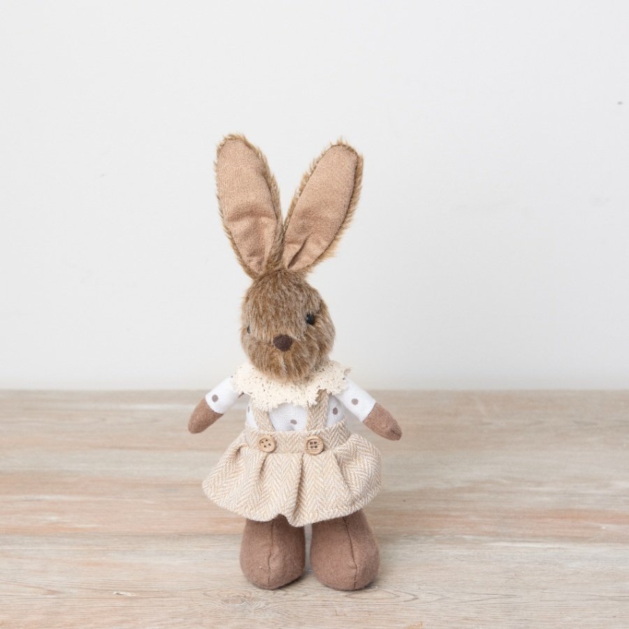 An adorable standing bunny decoration dressed in a charming outfit with a frill collar and polka dot blouse. 