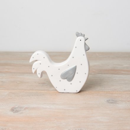 A chic hen ornament with grey heart shaped wing and polka dots. 