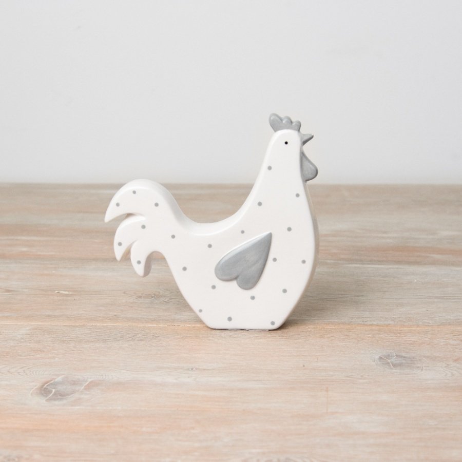 A rustic hen decoration. Beautifully shaped and hand painted with a heart wing and grey polka dots. 