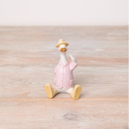 Add character and colour to the home with this charming sitting duck ornament in pastel yellow and white colours.