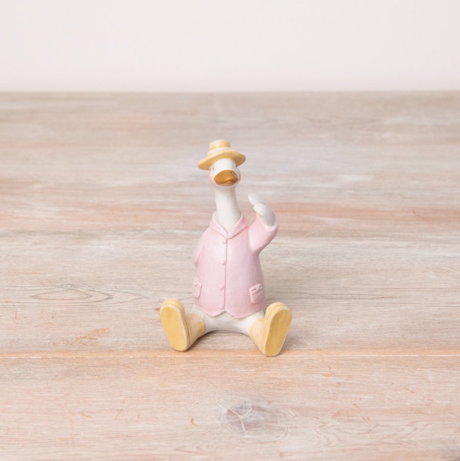 A pretty pastel coloured sitting duck decoration with charming details including wellies, jacket and a hat.