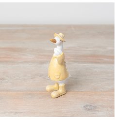 A chic standing duck ornament in fresh pastel yellow colours. An adorable item with yellow boots, hat and jacket.
