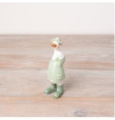 A charming duck ornament with wellies, jacket and a hat. In fresh sage green colours. 