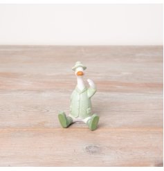 A unique duck ornament with green wellies, jacket and hat. 
