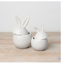 A chic egg shaped storage pot with bunny ears. 