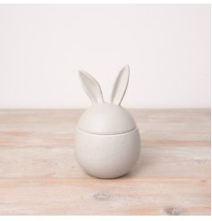 A chic egg shaped storage pot with bunny ears. 