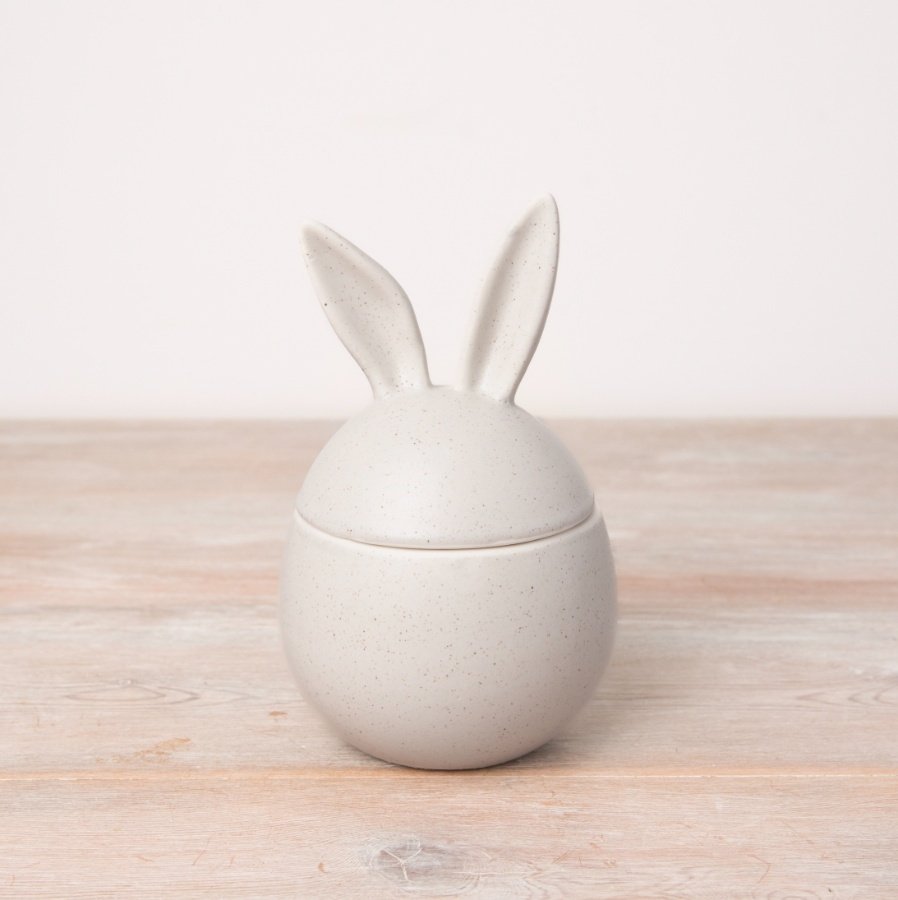 A chic egg shaped storage pot in a classic off-white colour with a detailed speckled finish. 