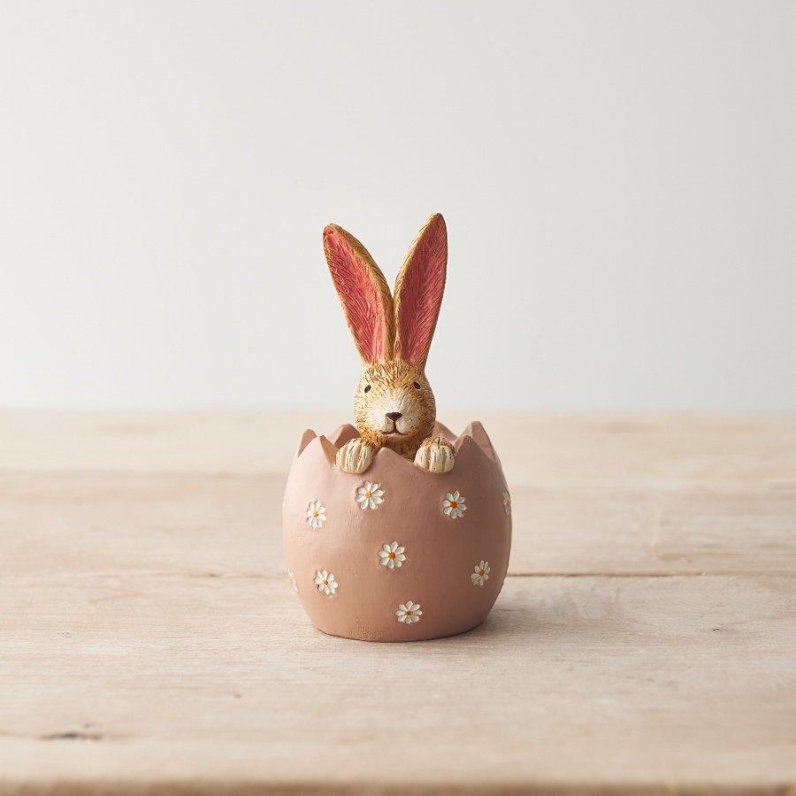 A chic and unique daisy egg ornament with bunny. A must have seasonal decoration and gift item. 