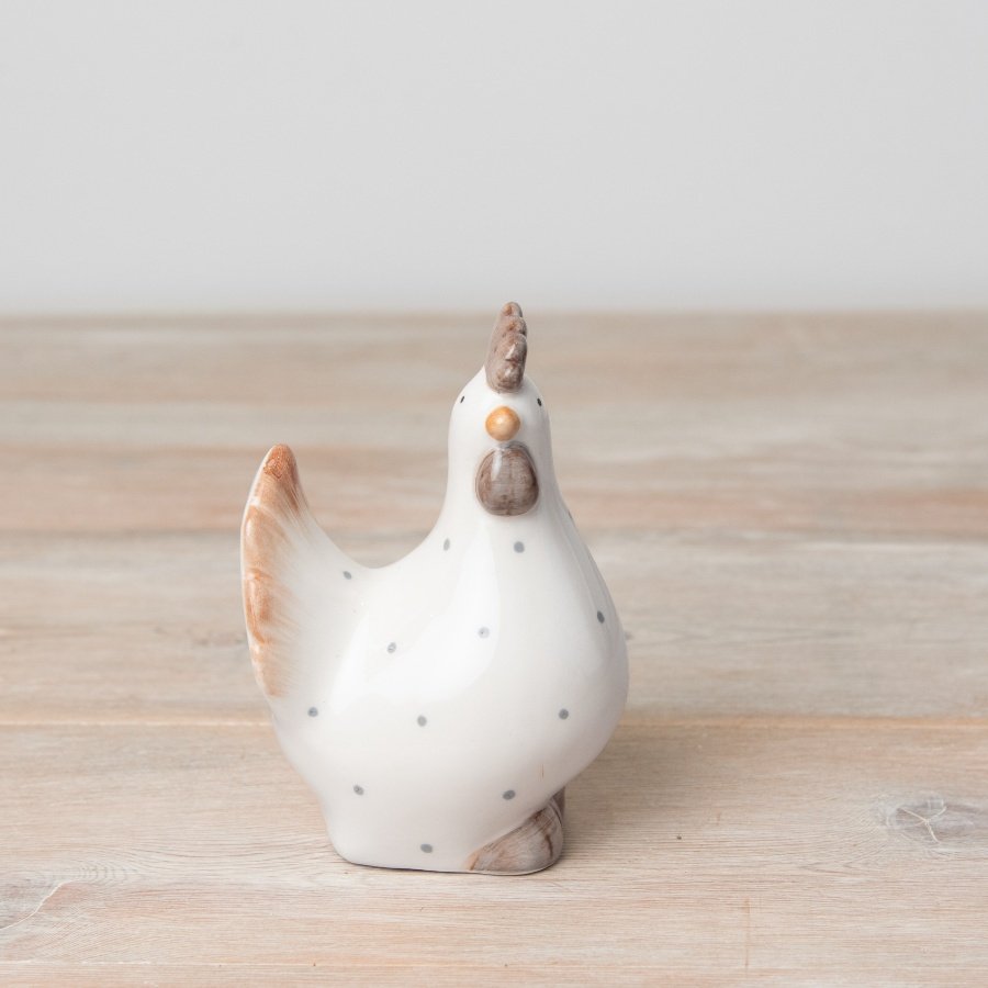 A chic, country style hen ornament in natural colours with a grey polka dot design.