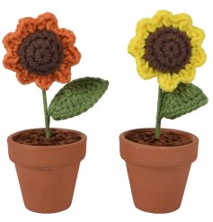 An assortment of 2 knitted flowers set in a plant pot.