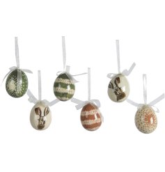 A pack of 6 hanging egg decorations in natural tones with different designs, finished with a simple glaze. 