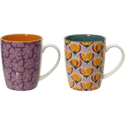 An assortment of 2 floral mugs. Each has a bold and beautiful print in stylish purple, orange and green colours. 