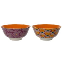 A mix of 2 floral bowls. Each has a bold design in vibrant colours. 