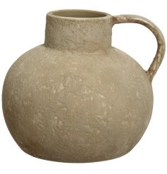 Add texture and style to the home with this unique jug with a sculptural shape and distressed finish. 