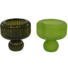 Assortment of two rippled glass candle holders that are sure to bring a unique and contemporary style to the home.