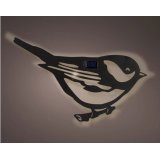 A black solar powered bird decoration for the outdoors.