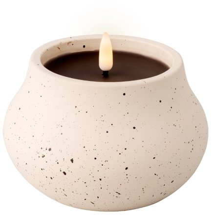 Create a cosy atmosphere in an outdoor space with this cream LED outdoor speckled candle.