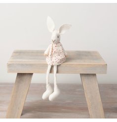 A pretty knitted rabbit decoration with a ditsy floral dress.