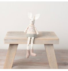 A charming white rabbit decoration with vintage inspired clothes. A chic gift item and seasonal decoration. 