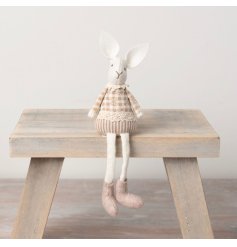 A chic fabric rabbit decoration with knitted legs and a charming lace item. 