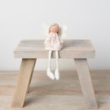 A charming knitted angel decoration with a ditsy floral dress and felt wings.