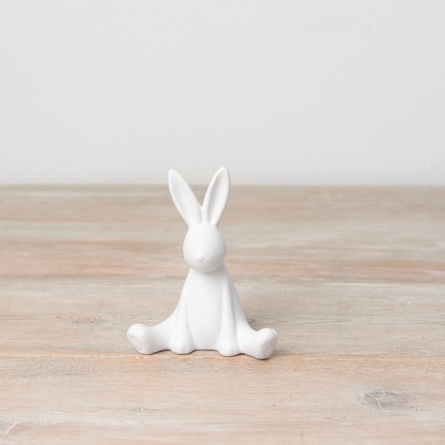 A chic and contemporary sitting bunny ornament in white. Complete with a textured surface finish. 