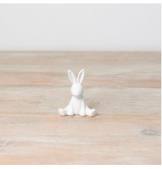 A chic sitting bunny ornament in white. Beautifully textured with cute and contemporary features.