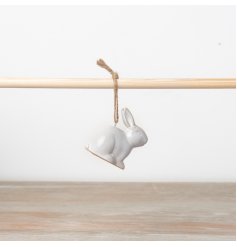 A chic and beautifully crafted bunny ornament with a natural glaze and rustic hanger.