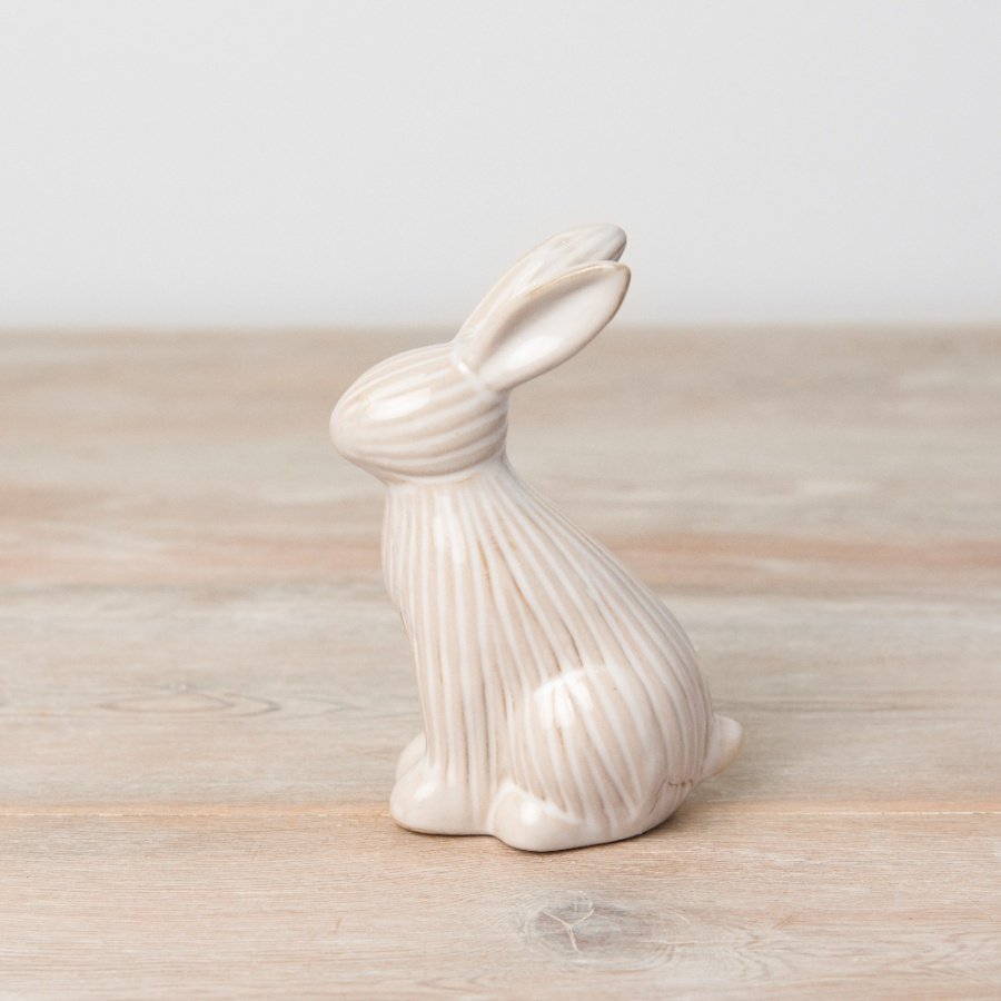 A charming bunny ornament in natural tones. Complete with a subtle ribbed surface.