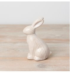 A charming and contemporary bunny ornament with a natural glaze and ribbed finish.