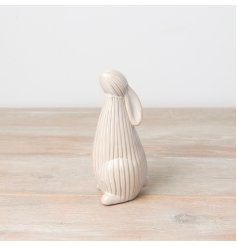 A chic and stylish standing bunny ornament with a two-tone ribbed surface finish. 