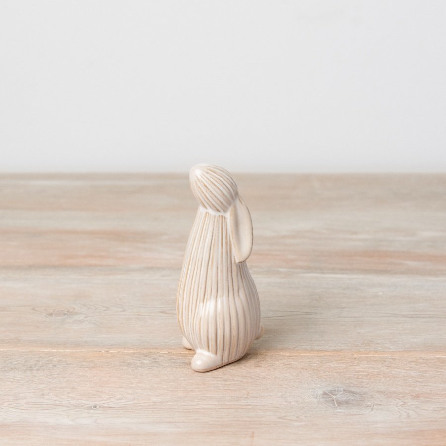 Introduce seasonal elegance to the home with this charming natural standing bunny. 